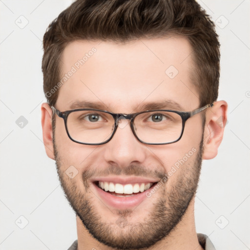 Joyful white young-adult male with short  brown hair and brown eyes