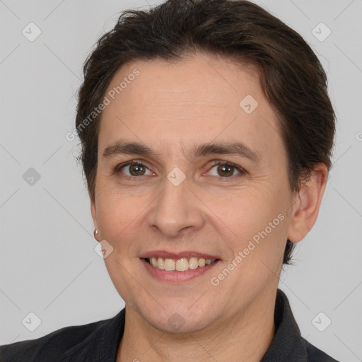 Joyful white adult female with short  brown hair and brown eyes