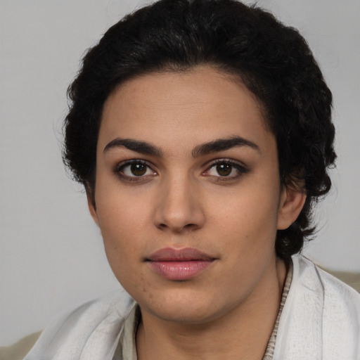 Neutral latino young-adult female with short  black hair and brown eyes
