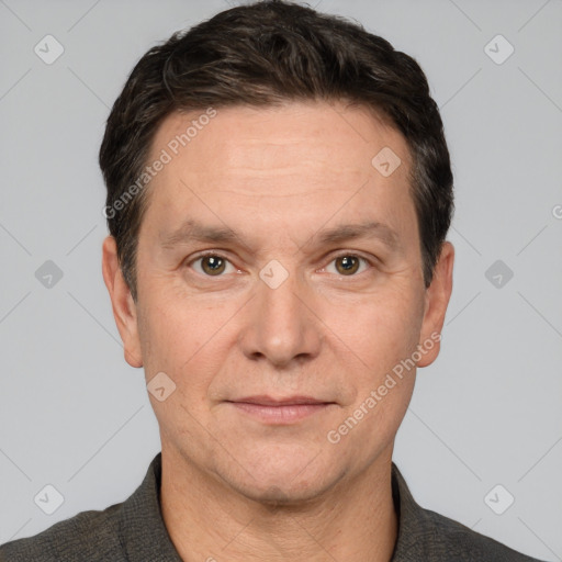 Joyful white adult male with short  brown hair and grey eyes