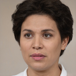 Joyful white adult female with short  brown hair and brown eyes