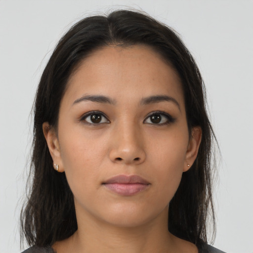 Neutral latino young-adult female with long  brown hair and brown eyes