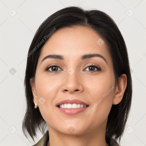 Joyful latino young-adult female with medium  brown hair and brown eyes