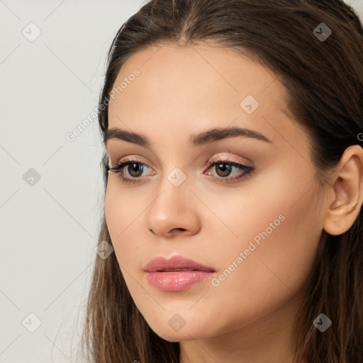 Neutral white young-adult female with long  brown hair and brown eyes