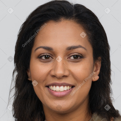 Joyful latino young-adult female with long  brown hair and brown eyes