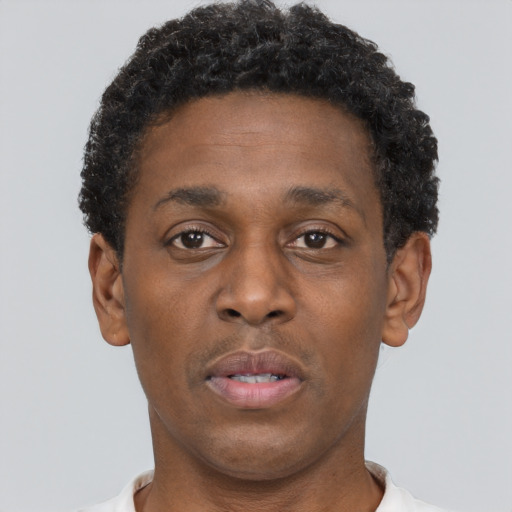 Neutral black young-adult male with short  brown hair and brown eyes