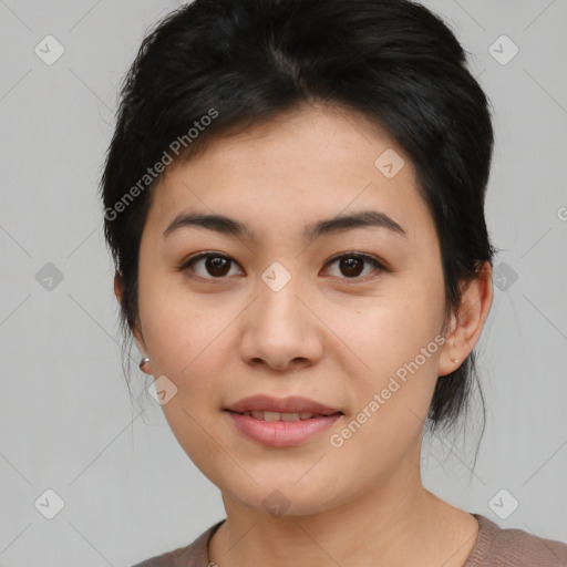 Joyful asian young-adult female with medium  black hair and brown eyes