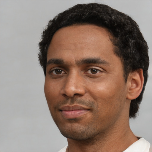 Neutral black young-adult male with short  black hair and brown eyes
