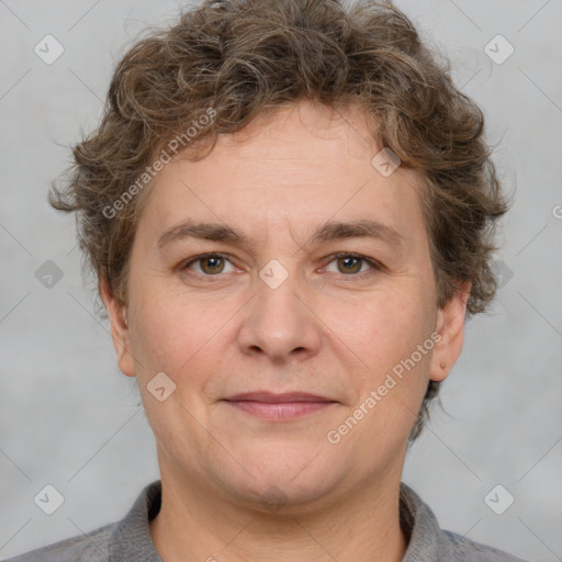 Joyful white adult male with short  brown hair and grey eyes