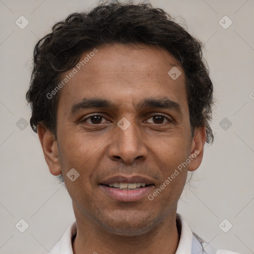 Joyful latino young-adult male with short  brown hair and brown eyes