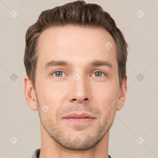 Joyful white young-adult male with short  brown hair and grey eyes