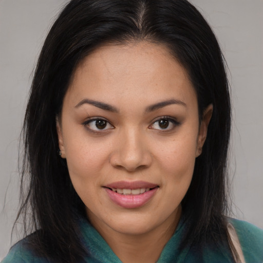 Joyful asian young-adult female with long  brown hair and brown eyes