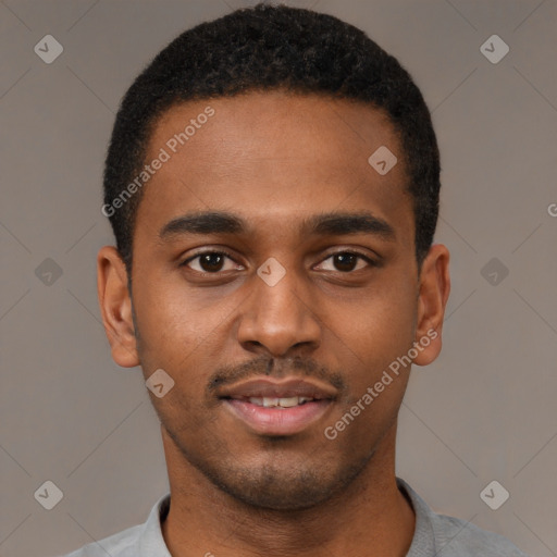 Joyful black young-adult male with short  brown hair and brown eyes