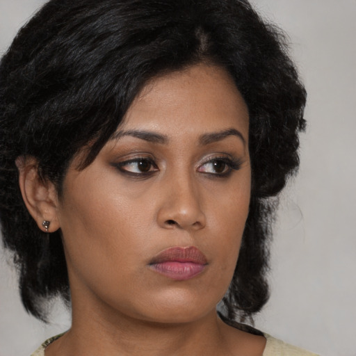 Neutral latino young-adult female with medium  black hair and brown eyes