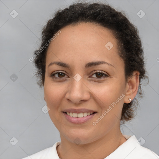 Joyful white adult female with short  brown hair and brown eyes