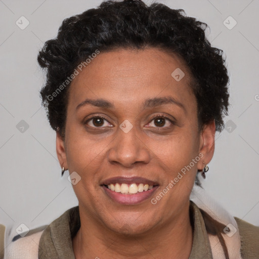 Joyful black adult female with short  brown hair and brown eyes