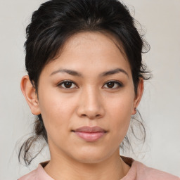 Joyful white young-adult female with medium  brown hair and brown eyes