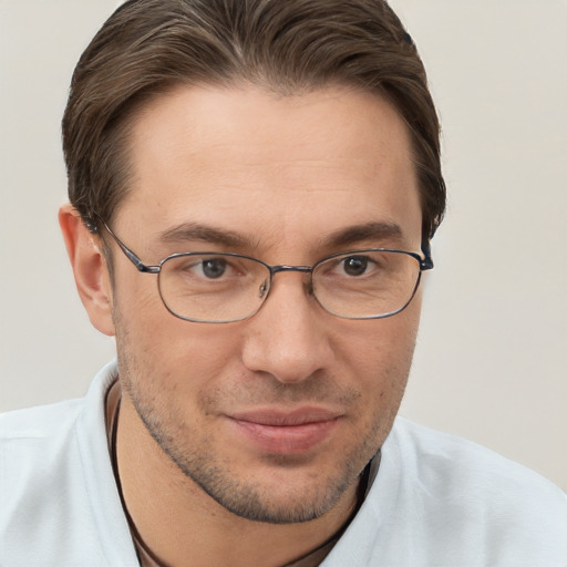 Joyful white adult male with short  brown hair and brown eyes