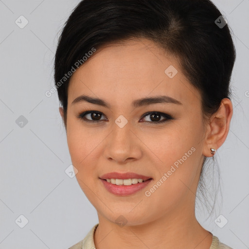 Joyful latino young-adult female with medium  brown hair and brown eyes