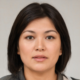 Neutral asian young-adult female with medium  brown hair and brown eyes