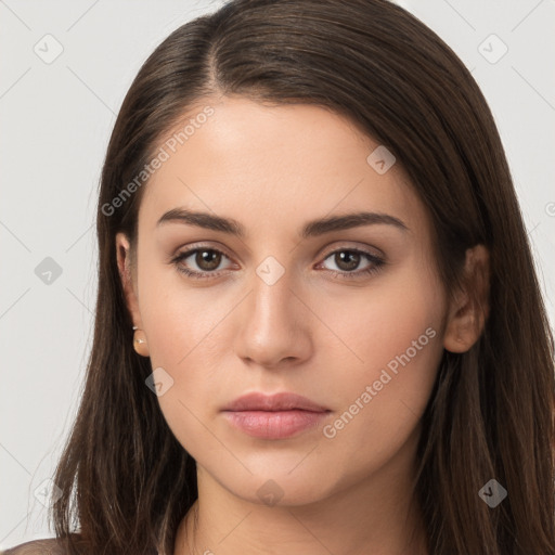 Neutral white young-adult female with long  brown hair and brown eyes