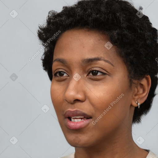 Neutral black young-adult female with short  black hair and brown eyes