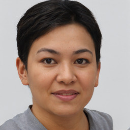 Joyful asian young-adult female with short  brown hair and brown eyes