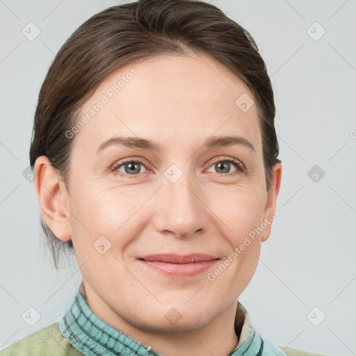 Joyful white adult female with short  brown hair and grey eyes