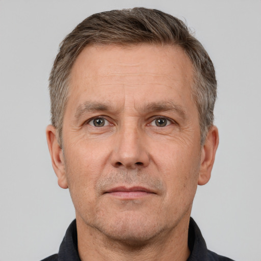 Neutral white middle-aged male with short  brown hair and brown eyes