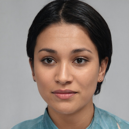Joyful latino young-adult female with medium  black hair and brown eyes