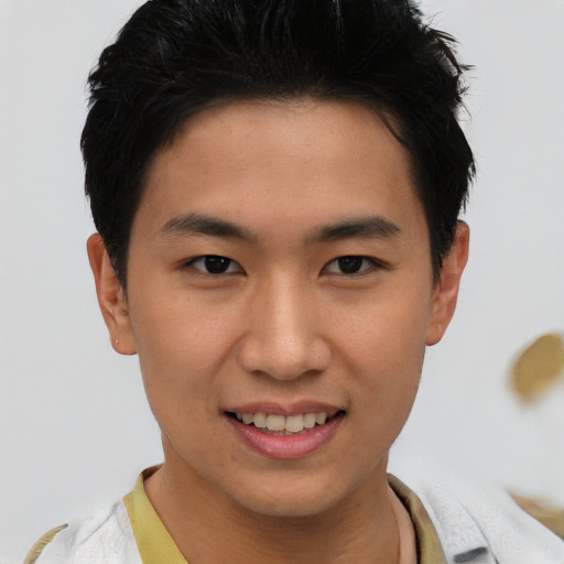 Joyful asian young-adult male with short  black hair and brown eyes