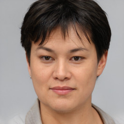 Joyful asian young-adult female with short  brown hair and brown eyes