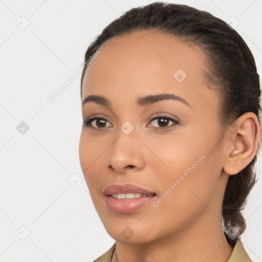 Joyful latino young-adult female with long  brown hair and brown eyes