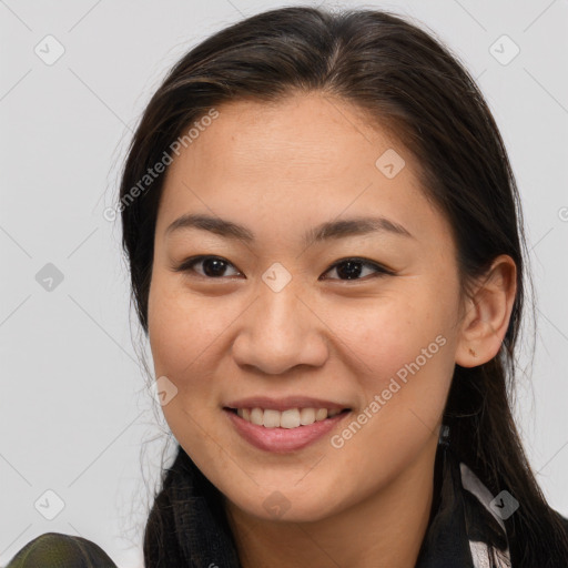 Joyful white young-adult female with long  brown hair and brown eyes