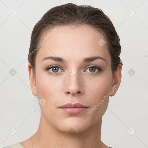 Neutral white young-adult female with short  brown hair and grey eyes