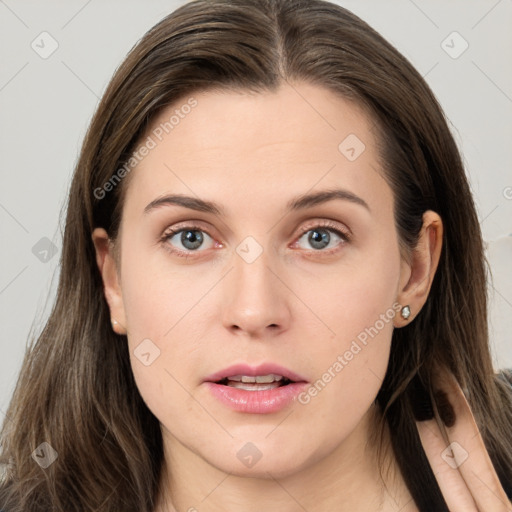 Neutral white young-adult female with long  brown hair and grey eyes