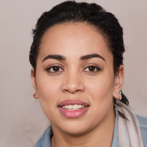 Joyful latino young-adult female with short  brown hair and brown eyes