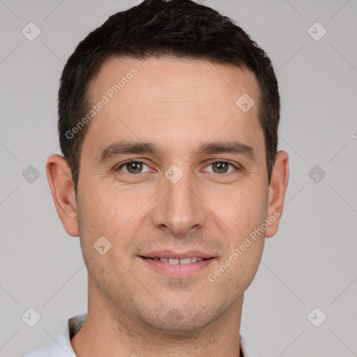 Joyful white young-adult male with short  brown hair and brown eyes