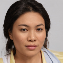 Joyful asian young-adult female with medium  brown hair and brown eyes