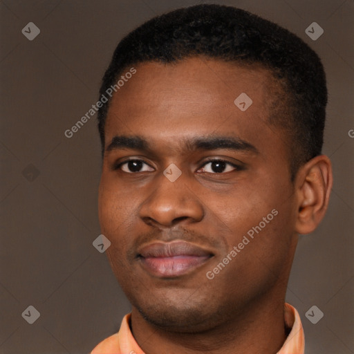 Joyful black young-adult male with short  brown hair and brown eyes