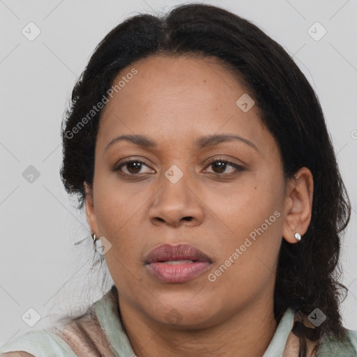 Joyful black adult female with medium  brown hair and brown eyes