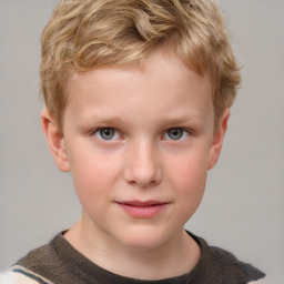 Joyful white child male with short  brown hair and grey eyes