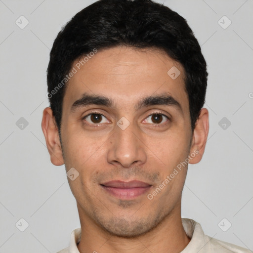 Joyful latino young-adult male with short  black hair and brown eyes