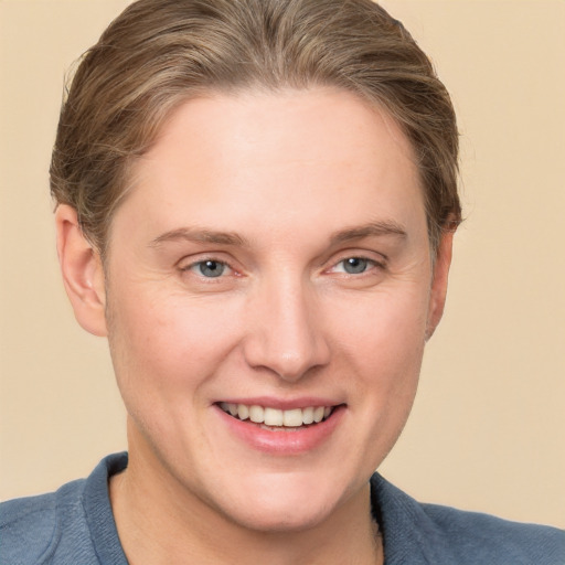 Joyful white young-adult female with short  brown hair and grey eyes