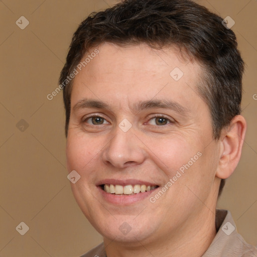 Joyful white adult male with short  brown hair and brown eyes