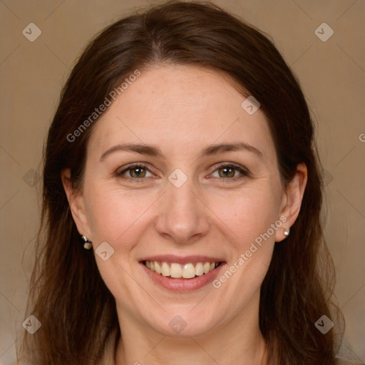 Joyful white adult female with long  brown hair and grey eyes