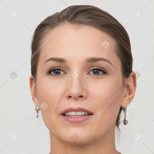 Joyful white young-adult female with short  brown hair and grey eyes