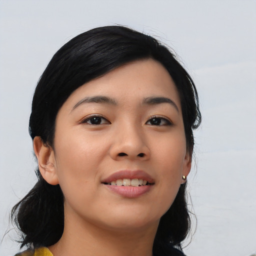 Joyful asian young-adult female with medium  black hair and brown eyes
