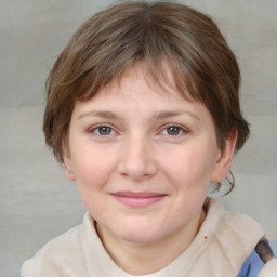 Joyful white young-adult female with medium  brown hair and blue eyes