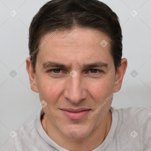 Joyful white adult male with short  brown hair and brown eyes